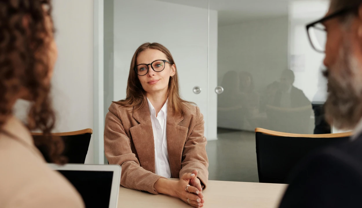 Cybersecurity company job interview with professional candidate speaking to hiring team in modern office setting