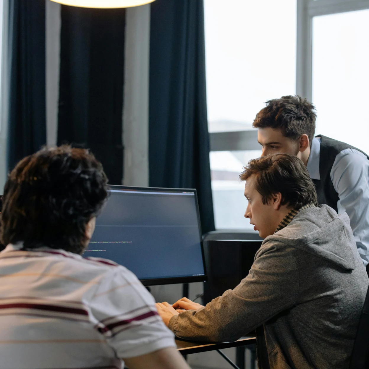 Technology team reviewing security outcomes after SecOps implementation