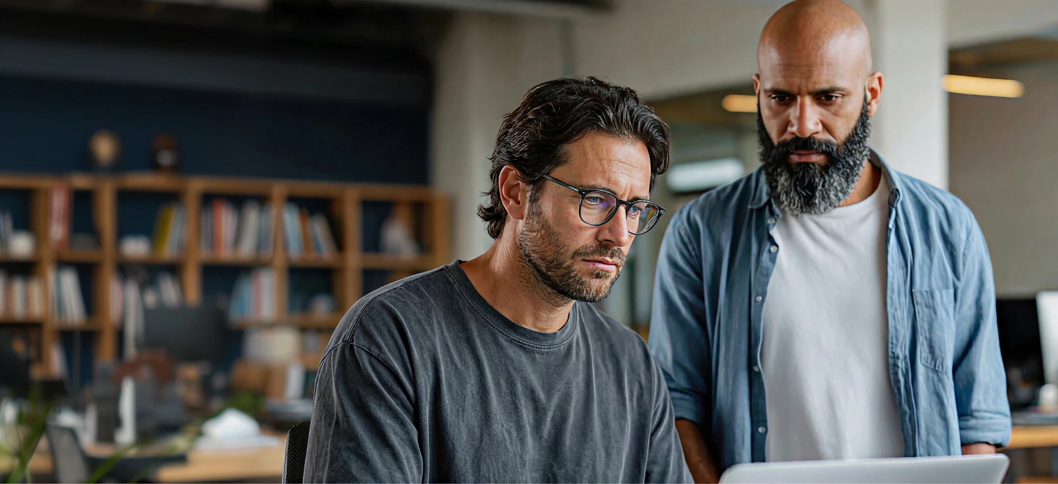 Security specialists reviewing cloud infrastructure and container workload activity